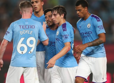The Man City players celebrate with goalscorer David Silva.
