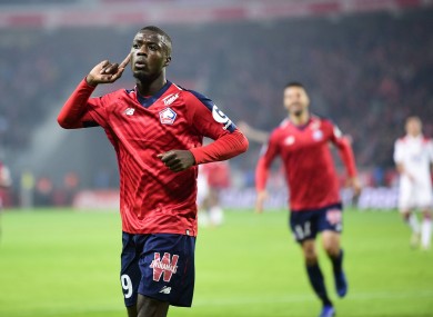 Nicolas Pepe celebrates scoring against Lyon.