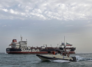 Iran's Revolutionary Guard circles a British-flagged speedboat.