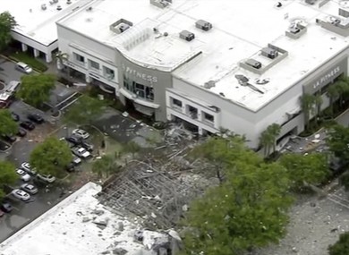 An image taken shows debris covering the car park of a shopping centre.