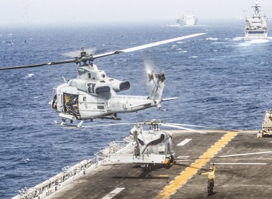 A US helicopter takes off from the assault ship USS Boxer during a transit of the Strait of Hormuz on Thursday.
