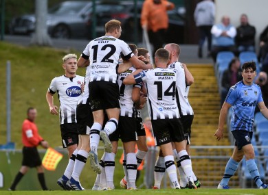 Dundalk players celebrate with goal scorer Daniel Cleary.