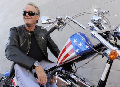 Fonda poses atop a Harley-Davidson, October 2009.