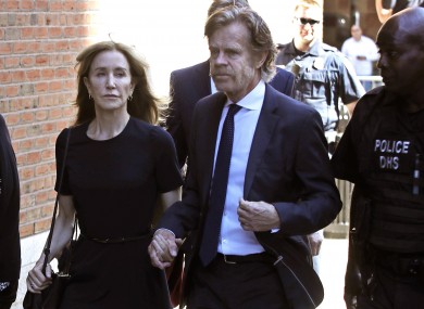 Felicity Huffman arrives at federal court with her husband William H. Macy for sentencing in a nationwide college admissions bribery scandal.