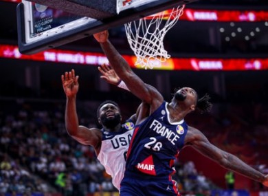 Jay Brown of USA and Mathias Lessort of France in action during today's quarter-final.