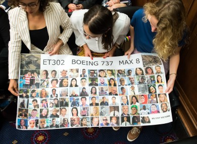 Hearing attendees hold a sign honoring the victims of the Ethiopian Airlines 302 crash during a House Transportation Subcommittee hearing on the Boeing 737 MAX on Capitol Hill in Washington, D.C. on June 19, 2019.