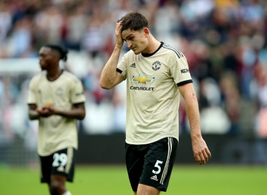 Manchester United's Harry Maguire appears dejected after the final whistle.