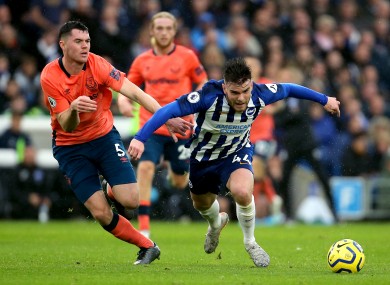 Connolly and Michael Keane battle for the ball.