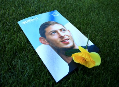 A Cardiff City match programme featuring an image of the late striker.