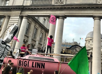 Activists march past Leinster House during today's protest.