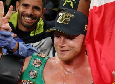 Saul 'Canelo' Alvarez celebrates after becoming a four-weight world champion.