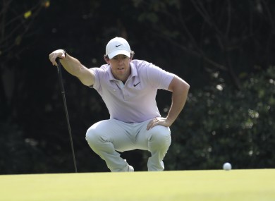 McIlroy sizes up a putt in Shanghai.