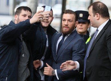 Members of the public outside the court today with McGregor.