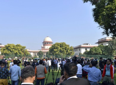 Crowds gather outside the Supreme Court in New Delhi.