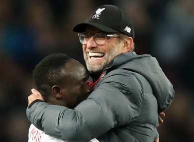 Jurgen Klopp celebrates victory at Villa Park with Sadio Mane.