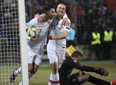 Ronaldo celebrates with his team-mate Diogo Jota after he scored his side's second goal.