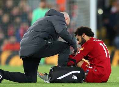 Salah receives treatment during Liverpool's victory over Man City.
