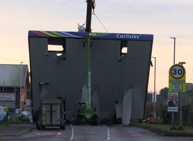 A crane removing the forecourt roof of Carlisle's filling station following an attempted ATM robbery.