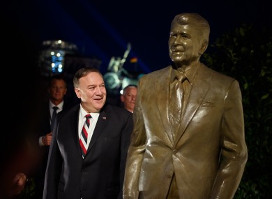 US Secretary of State Mike Pompeo pictured next to a statue of former US President Ronald Reagan at the US Embassy in Berlin today.