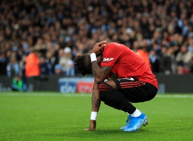 Manchester United's Fred reacts after being hit by thrown objects.