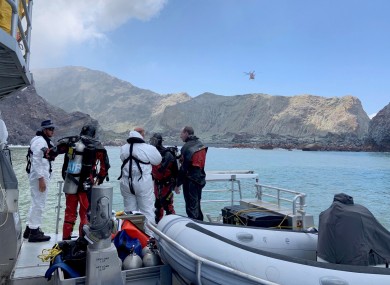 Police divers preparing to search the waters near White Island.