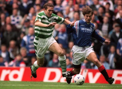 Alan Stubbs (left) battles for possession with Brian Laudrup.
