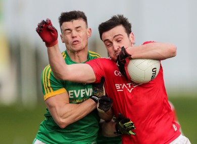 Meath's Gavin McCoy in action against Louth's Tommy Durnin.