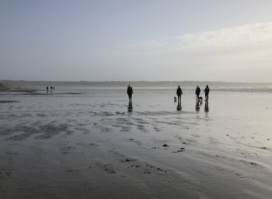 St Stephen's Day walkers on Tramore Beach, Co Waterford.