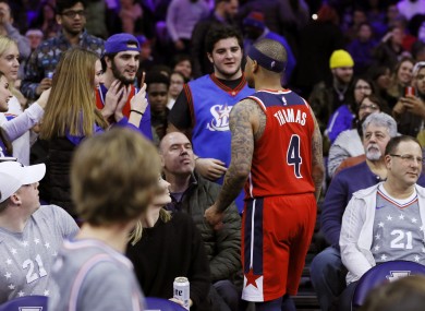 Isaiah Thomas confronts a fan during the Washington Wizards' 125-108 defeat to the Philadelphia 76ers.