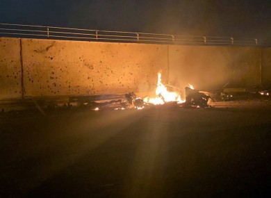 The remains of the vehicle outside Baghdad airport following the US airstrike.