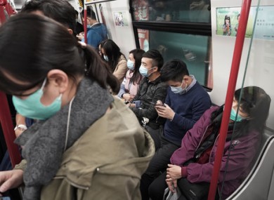 Passengers wear masks in Hong Kong.