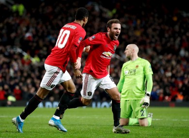 Manchester United's Juan Mata (right) celebrates scoring.
