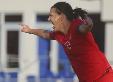 Christine Sinclair celebrates after scoring against St. Kitts and Nevis.
