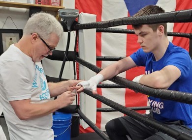 Roach wraps Aaron McKenna's hands.