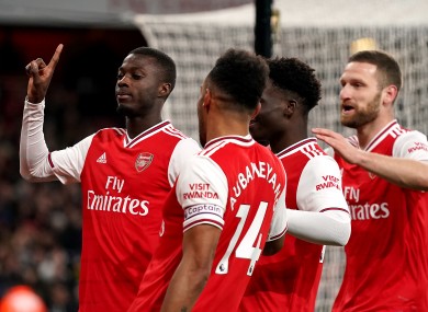 Arsenal's Nicolas Pepe (left) celebrates scoring his side's second goal of the game with team-mates.