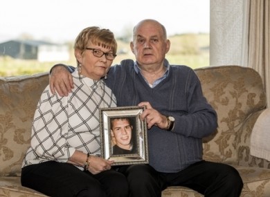 Stephen and Breege Quinn holding a picture of their murdered son Paul Quinn.