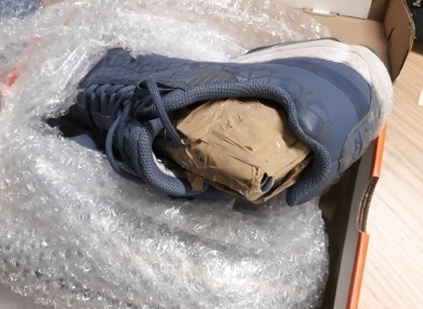 Concealed package of cocaine inside a pair of runners.