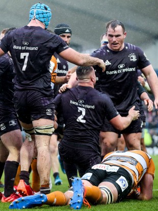 Leinster’s Ronan Kelleher celebrates his try with Peter Dooley and Will Connors.
