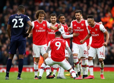 Arsenal celebrate their late win today.