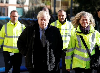 Johnson with police and emergency workers in England today.