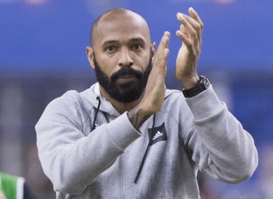 Montreal Impact head coach Thierry Henry salutes fans.