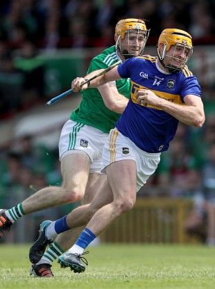 Tipperary's Seamus Callanan and Limerick's Richie English in action in last year's Munster final.