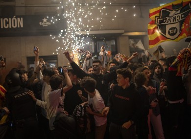 Valencia fans show support outside the stadium.