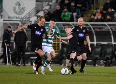 Jack Byrne of Shamrock Rovers with Greg Sloggett and Sean Hoare of Dundalk.