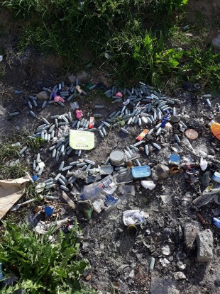 The discarded silver gas canisters.