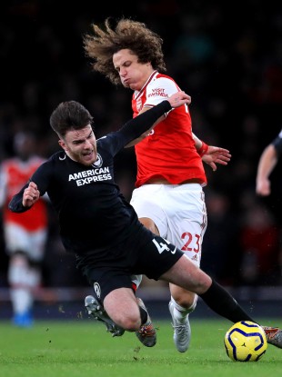 Aaron Connolly tangles with David Luiz during the Premier League game between Arsenal and Brighton last December.