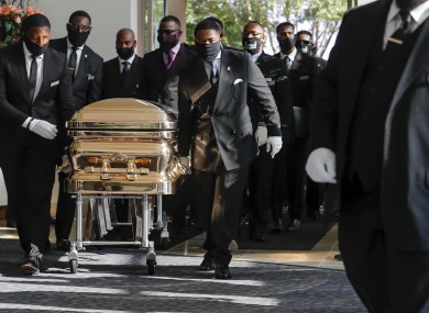 Pallbearers bring the coffin of George Floyd into a church in Houston ahead of his funeral