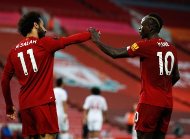 Salah and Mane celebrate Liverpool's fourth goal.