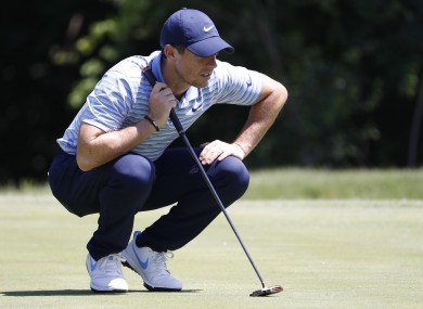 Rory McIlroy lines up a putt on the 11th green during the third round of the Charles Schwab Challenge.
