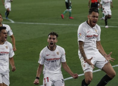 Sevilla's Lucas Ocampos celebrates after scoring against Real Betis.